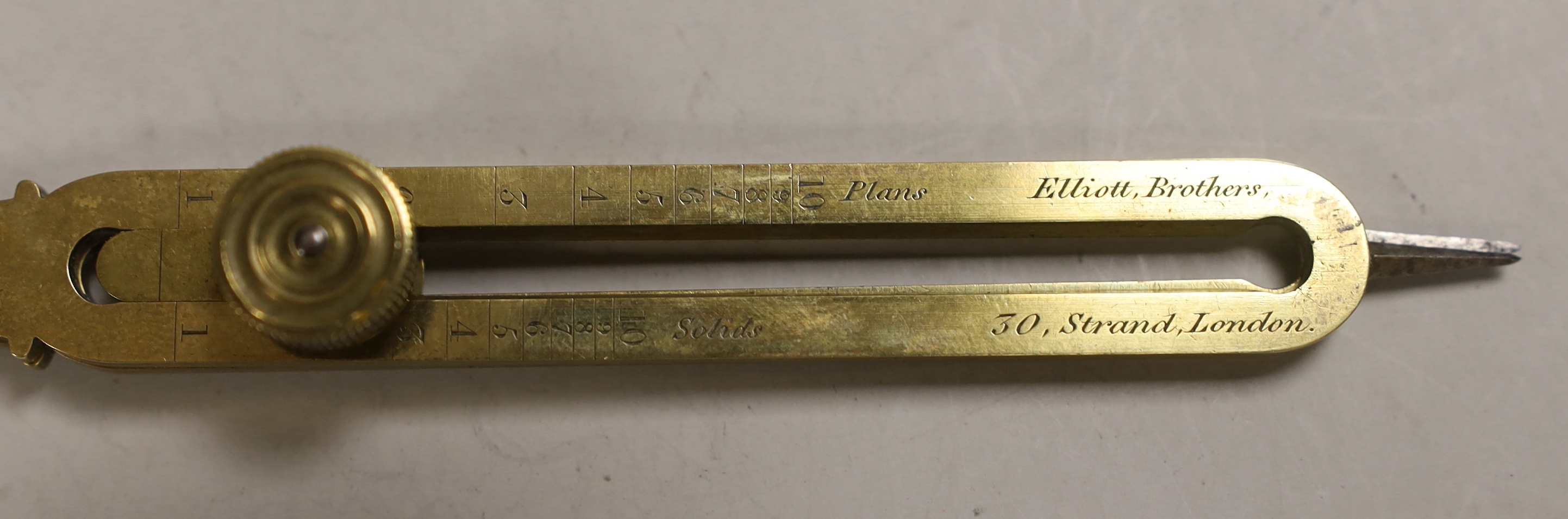 A 19th century brass and steel proportional compasses, Elliott Bros., 30 The Strand, engraved WCC, 15th Regt (East Yorks Regiment), in morocco case